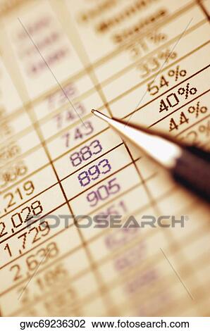 Close-up of a pen on a stock market report View Large Photo Image Stock Image - Close-up of a pen on a stock market report. Fotosearch