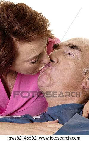 Close-up of a senior couple kissing View Large Photo Image Stock Image - Close-up of a senior couple kissing. Fotosearch