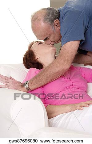 Close-up of a senior couple kissing View Large Photo Image Stock Image - Close-up of a senior couple kissing. Fotosearch