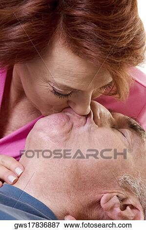 Close-up of a senior couple kissing View Large Photo Image Stock Photo - Close-up of a senior couple kissing. Fotosearch