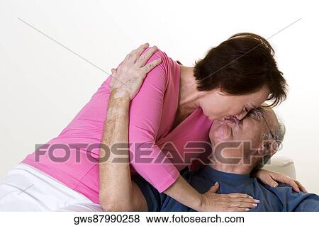 Close-up of a senior couple kissing View Large Photo Image Stock Photo - Close-up of a senior couple kissing. Fotosearch
