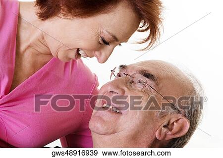 Close-up of a senior couple looking at each other View Large Photo Image Stock Photo - Close-up of a senior couple looking at each other. Fotosearch