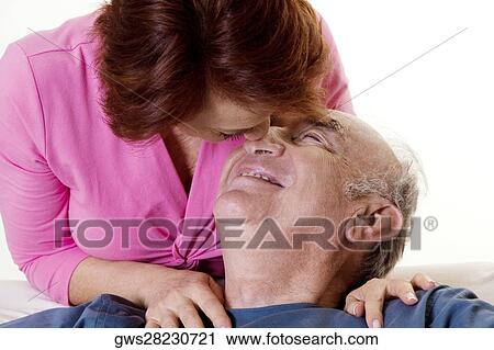 Close-up of a senior couple nuzzling View Large Photo Image Stock Image - Close-up of a senior couple nuzzling. Fotosearch
