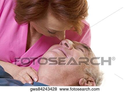 Close-up of a senior couple nuzzling View Large Photo Image Stock Photo - Close-up of a senior couple nuzzling. Fotosearch
