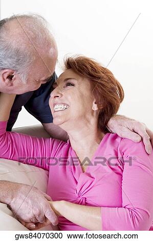 Close-up of a senior couple smiling View Large Photo Image Stock Image - Close-up of a senior couple smiling. Fotosearch