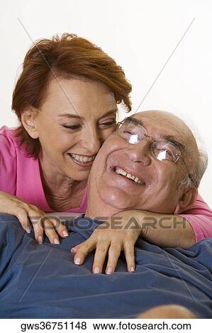 Close-up of a senior couple smiling View Large Photo Image Stock Photo - Close-up of a senior couple smiling. Fotosearch