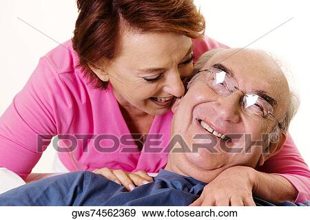 Stock Photo - Close-up of a senior couple smiling. Fotosearch