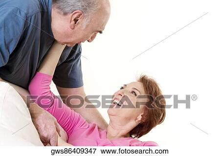 Close-up of a senior couple smiling View Large Photo Image Stock Photo - Close-up of a senior couple smiling. Fotosearch