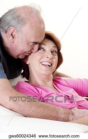 Close-up of a senior couple smiling View Large Photo Image Stock Photograph - Close-up of a senior couple smiling. Fotosearch