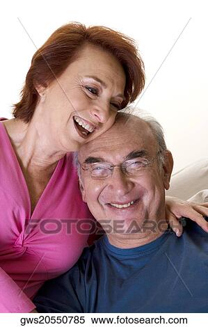 Close-up of a senior couple smiling View Large Photo Image Stock Photography - Close-up of a senior couple smiling. Fotosearch