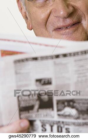 Close-up of a senior man reading a newspaper View Large Photo Image Stock Photo - Close-up of a senior man reading a newspaper. Fotosearch