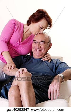 Close-up of a senior woman kissing a senior man View Large Photo Image Stock Photo - Close-up of a senior woman kissing a senior man. Fotosearch