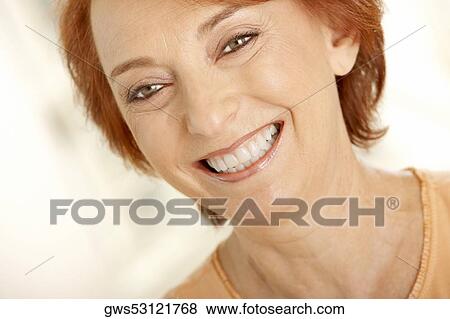 Close-up of a senior woman smiling View Large Photo Image Stock Photo - Close-up of a senior woman smiling. Fotosearch