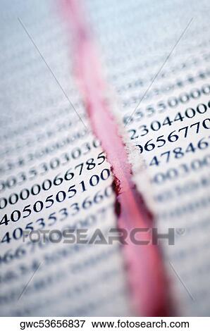 Close-up of a torn financial page View Large Photo Image Stock Photo - Close-up of a torn financial page. Fotosearch