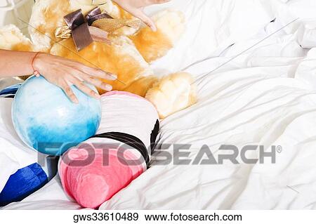 Close-up of a woman's hand holding a ball View Large Photo Image Stock Photo - Close-up of a woman's hand holding a ball. Fotosearch