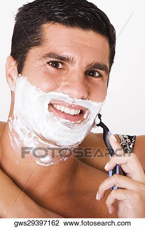 Close-up of a woman's hand shaving a mid adult man View Large Photo Image Stock Image - Close-up of a woman's hand shaving a mid adult man. Fotosearch