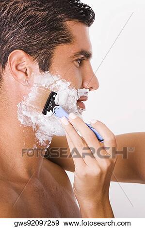 Close-up of a woman's hand shaving a mid adult man View Large Photo Image Stock Photo - Close-up of a woman's hand shaving a mid adult man. Fotosearch