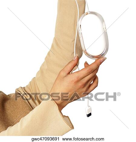 Stock Image - Close-up of a woman's hands holding a computer mouse. Fotosearch