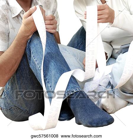 Close-up of a young couple holding a receipt View Large Photo Image Stock Photo - Close-up of a young couple holding a receipt. Fotosearch