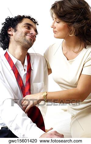 Close-up of a young couple looking at each other View Large Photo Image Stock Image - Close-up of a young couple looking at each other. Fotosearch