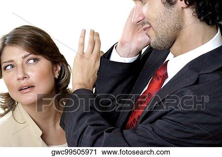 Close-up of a young couple looking at each other View Large Photo Image Stock Image - Close-up of a young couple looking at each other. Fotosearch