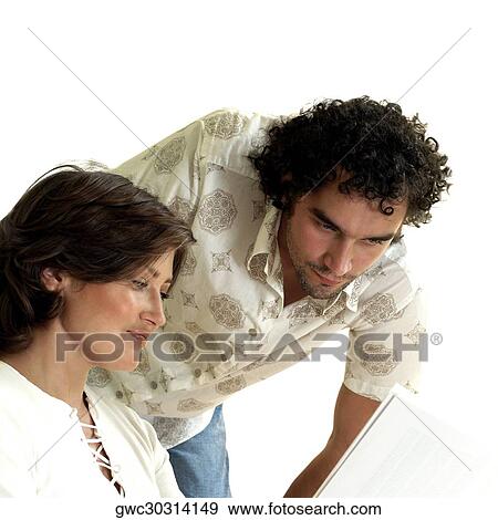 Close-up of a young couple looking down View Large Photo Image Stock Photo - Close-up of a young couple looking down. Fotosearch
