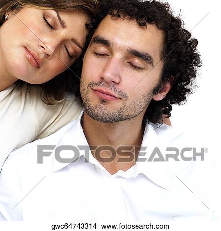 Picture - Close-up of a young couple sleeping. Fotosearch