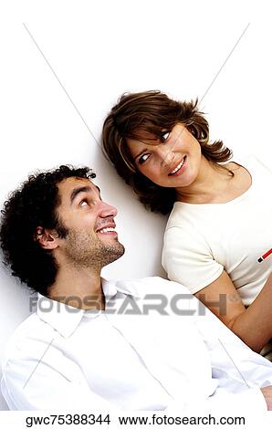 Picture - Close-up of a young couple smiling. Fotosearch