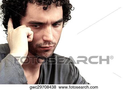 Stock Photo - Close-up of a young man contemplating. Fotosearch