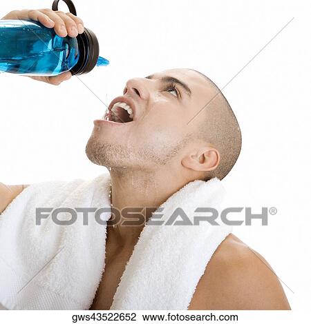 Close-up of a young man drinking water View Large Photo Image Stock Image - Close-up of a young man drinking water. Fotosearch