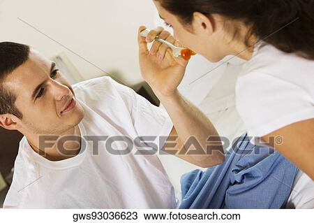 Close-up of a young man feeding a young woman cherries View Large Photo Image Stock Image - Close-up of a young man feeding a young woman cherries. Fotosearch