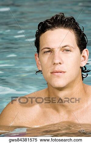 Close-up of a young man in a swimming pool View Large Photo Image Stock Photography - Close-up of a young man in a swimming pool. Fotosearch