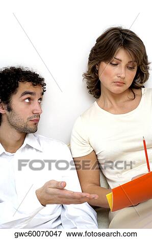 Stock Photo - Close-up of a young man looking at a young woman. Fotosearch