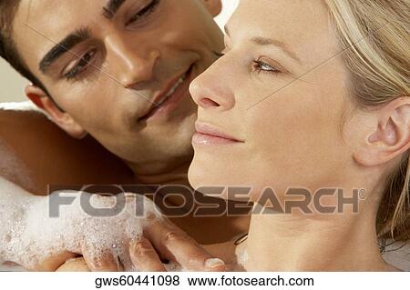 Close-up of a young man massaging a young woman View Large Photo Image Stock Photo - Close-up of a young man massaging a young woman. Fotosearch