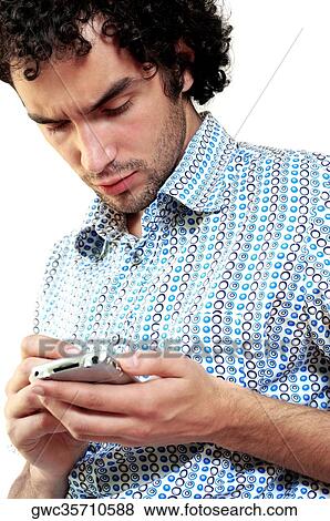 Stock Photo - Close-up of a young man operating a personal data assistant. Fotosearch