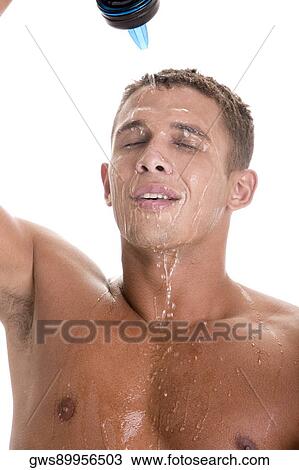 Close-up of a young man pouring water on his face View Large Photo Image Stock Image - Close-up of a young man pouring water on his face. Fotosearch