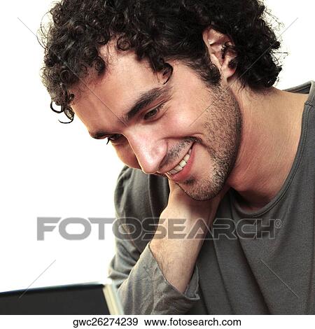 Close-up of a young man smiling View Large Photo Image Stock Photo - Close-up of a young man smiling. Fotosearch