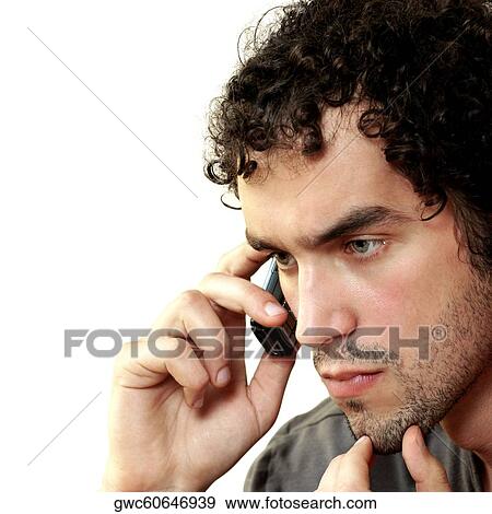 Stock Photo - Close-up of a young man talking on a mobile pone. Fotosearch
