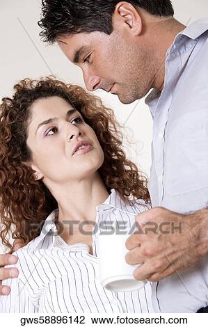 Close-up of a young woman and a mid adult man View Large Photo Image Stock Image - Close-up of a young woman and a mid adult man. Fotosearch