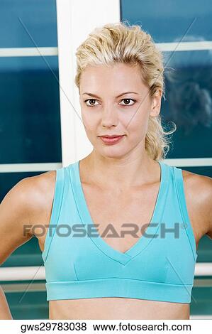 Close-up of a young woman in a sports bra View Large Photo Image Stock Photo - Close-up of a young woman in a sports bra. Fotosearch