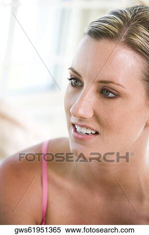 Stock Photography - Close-up of a young woman looking away. Fotosearch