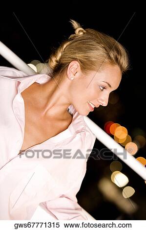 Close-up of a young woman looking away View Large Photo Image Stock Photography - Close-up of a young woman looking away. Fotosearch