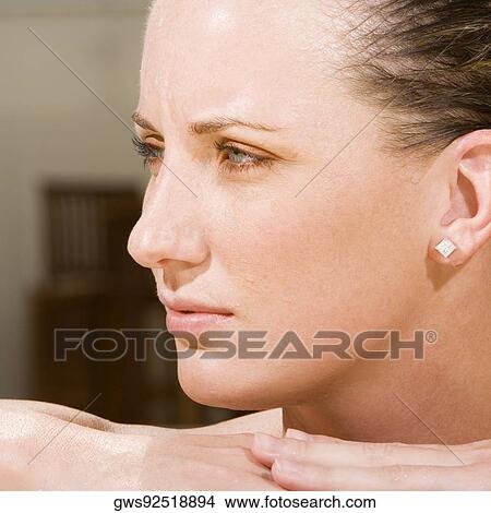 Picture - Close-up of a young woman looking sideways. Fotosearch