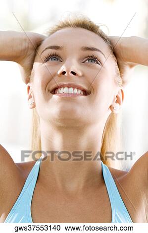 Close-up of a young woman looking up View Large Photo Image Stock Image - Close-up of a young woman looking up. Fotosearch