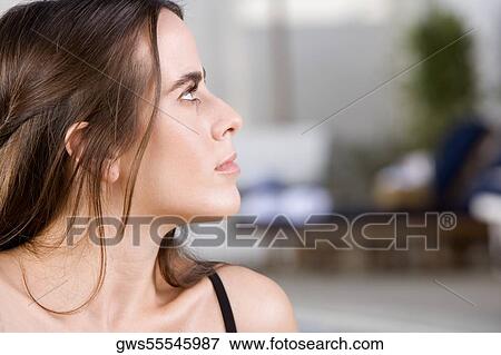 Stock Photo - Close-up of a young woman looking up. Fotosearch