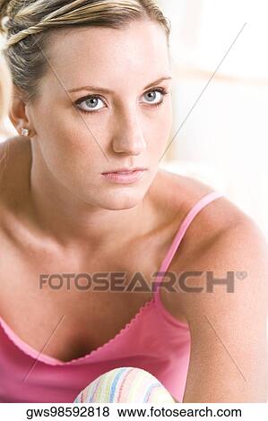Close-up of a young woman looking up View Large Photo Image Stock Photo - Close-up of a young woman looking up. Fotosearch