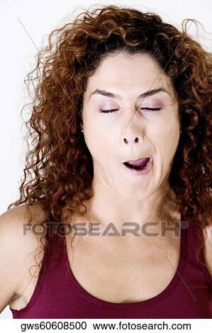 Close-up of a young woman making a face View Large Photo Image Stock Image - Close-up of a young woman making a face. Fotosearch