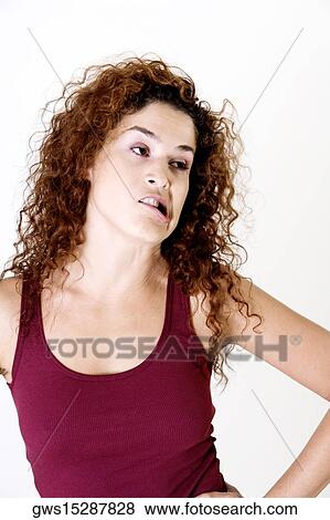 Close-up of a young woman making a face View Large Photo Image Stock Photo - Close-up of a young woman making a face. Fotosearch