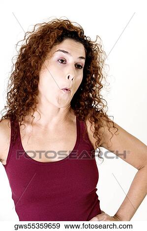 Stock Photo - Close-up of a young woman making a face. Fotosearch