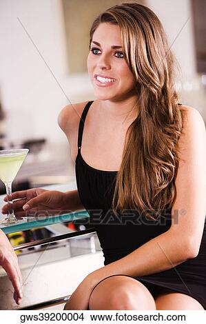 Close-up of a young woman smiling View Large Photo Image Picture - Close-up of a young woman smiling. Fotosearch